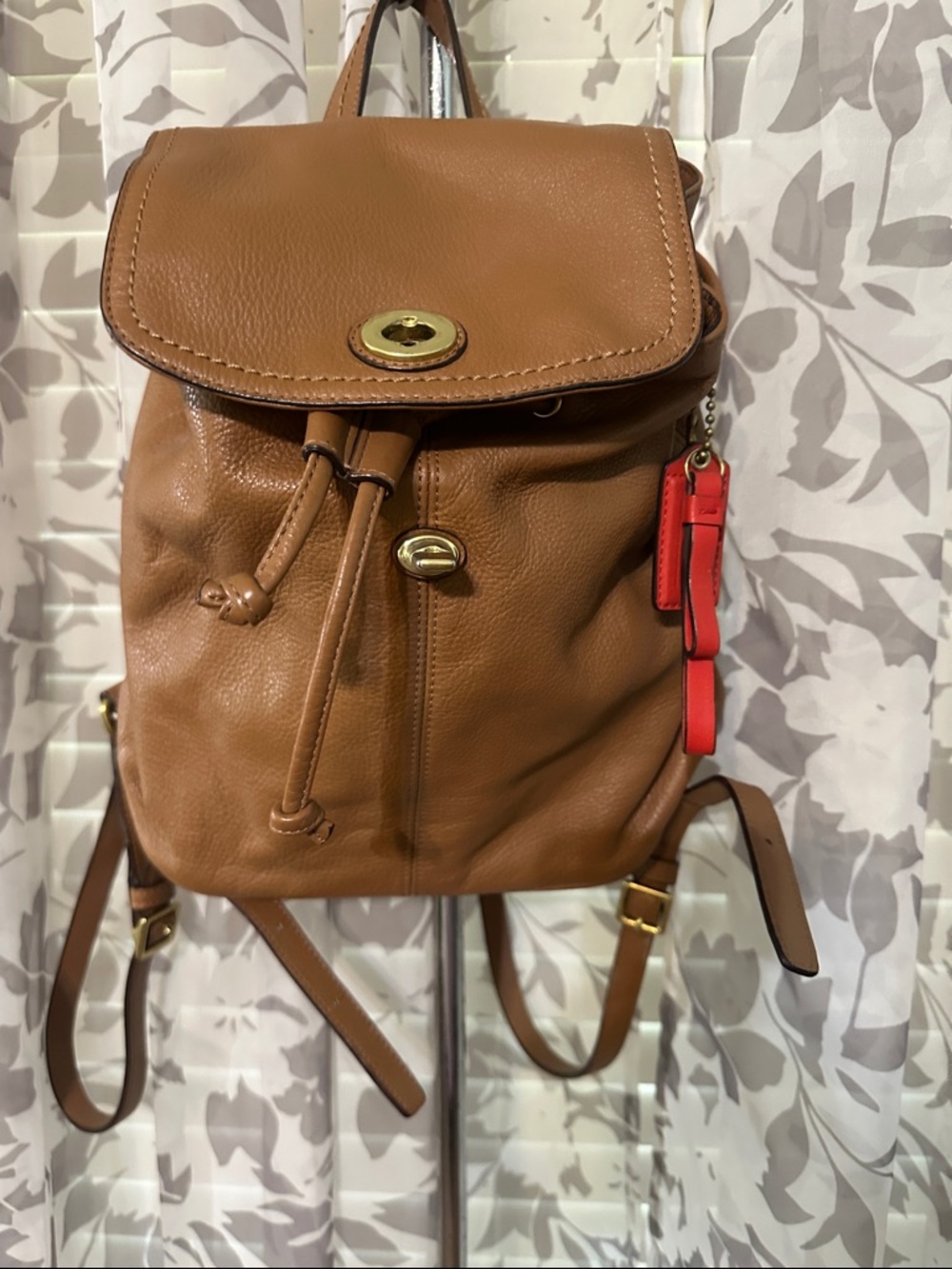 Coach Tan Leather Drawstring Backpack with Red Charm